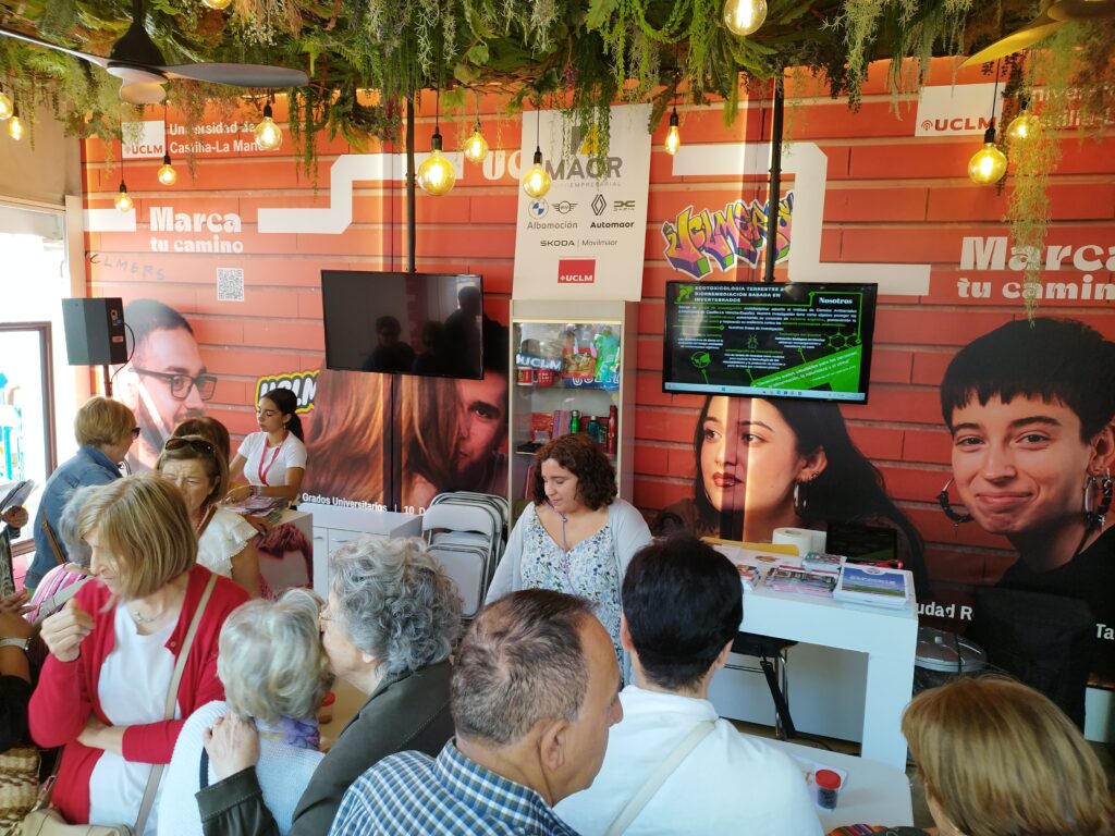 image of people gathering around UCLM stand