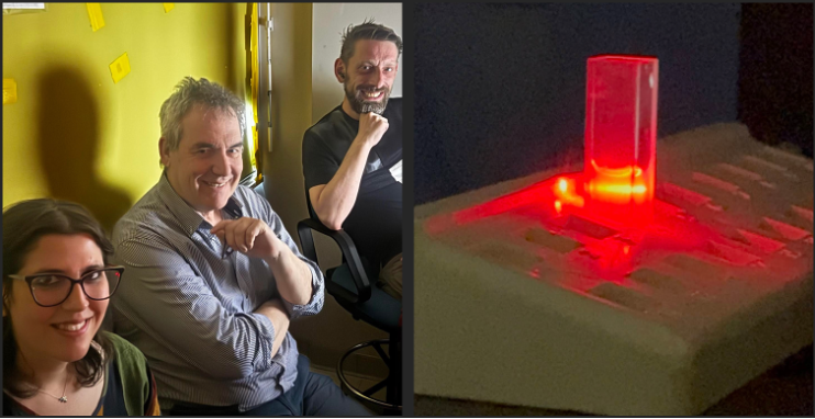 three researchers and a technical instrument at work